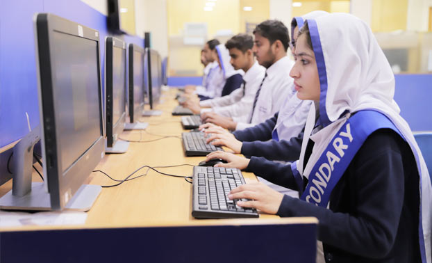 Deaf students learning through computer during their IT period